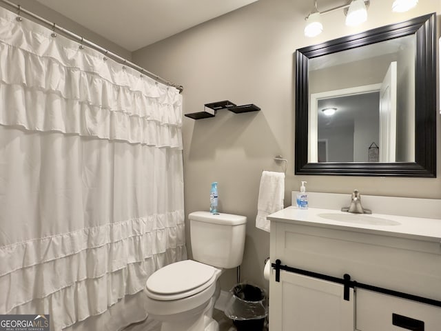 bathroom with vanity and toilet