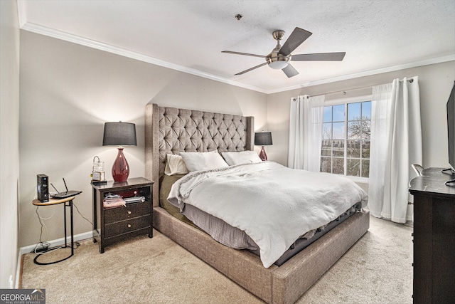 carpeted bedroom with ceiling fan, ornamental molding, and a textured ceiling