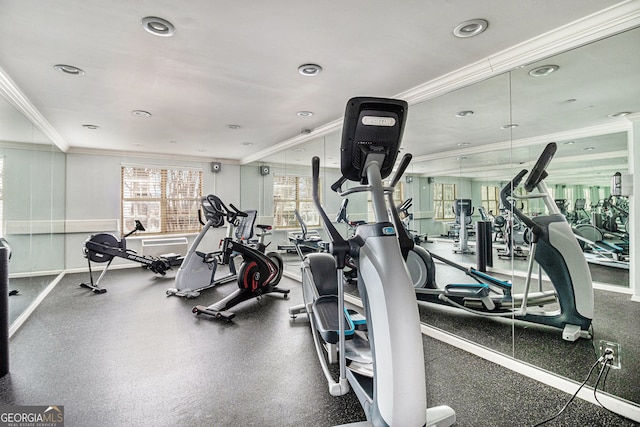 workout area featuring ornamental molding