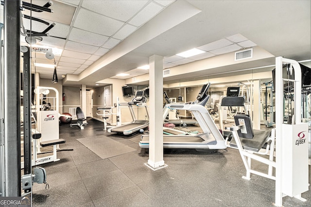 gym featuring a drop ceiling