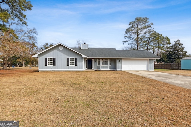 ranch-style house with a garage, central AC, and a front lawn