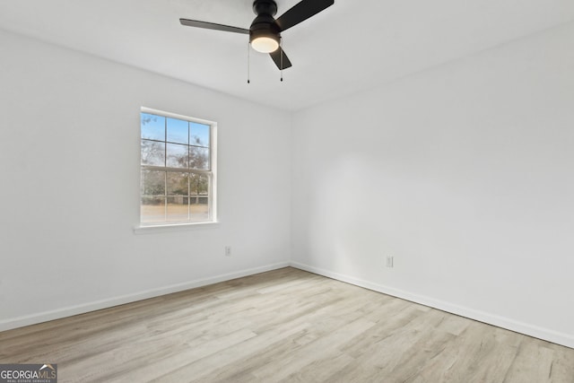 spare room featuring ceiling fan and light hardwood / wood-style flooring