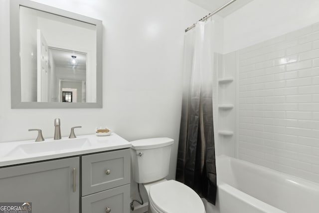 full bathroom with vanity, toilet, and shower / bath combo with shower curtain