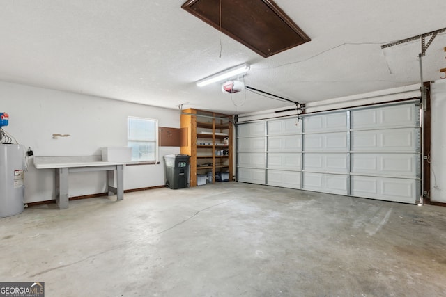 garage with a garage door opener and electric water heater