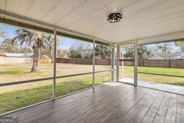 unfurnished sunroom featuring a healthy amount of sunlight