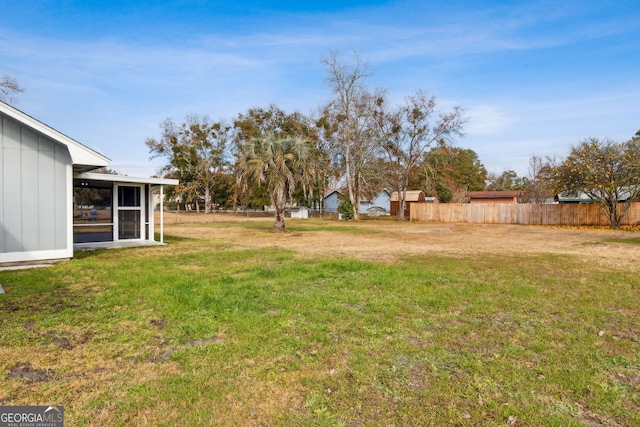 view of yard featuring a sunroom