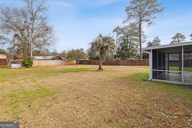 view of yard featuring a sunroom