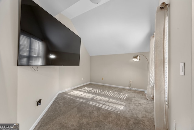 bonus room featuring lofted ceiling and carpet floors