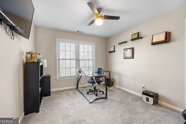 home office featuring ceiling fan and light carpet