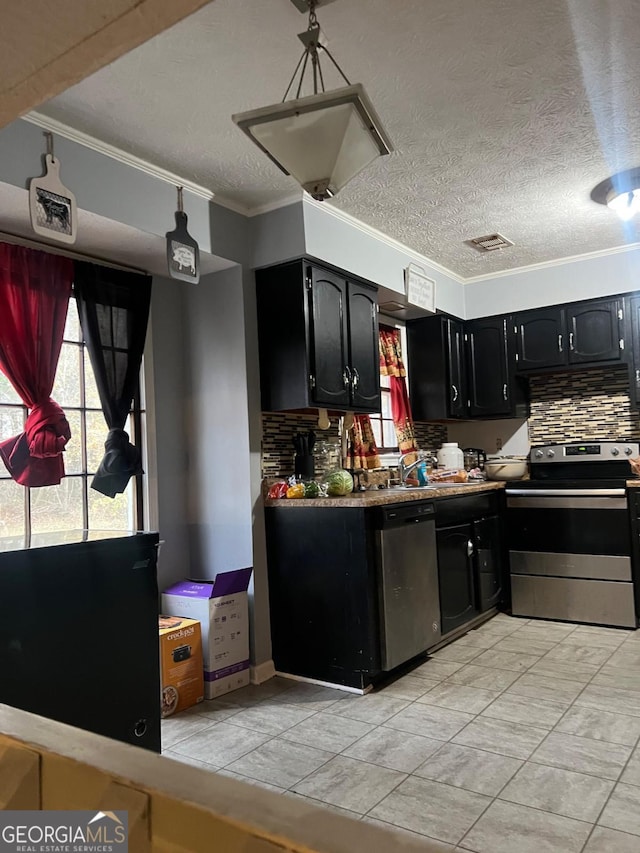 kitchen with sink, ventilation hood, ornamental molding, and appliances with stainless steel finishes