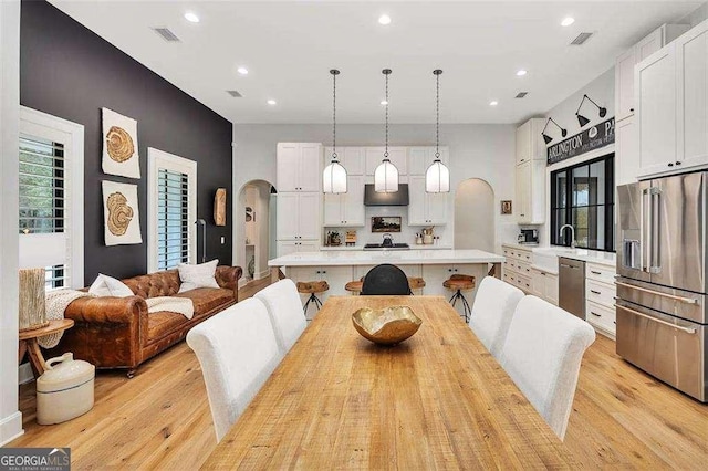 dining space featuring light hardwood / wood-style floors