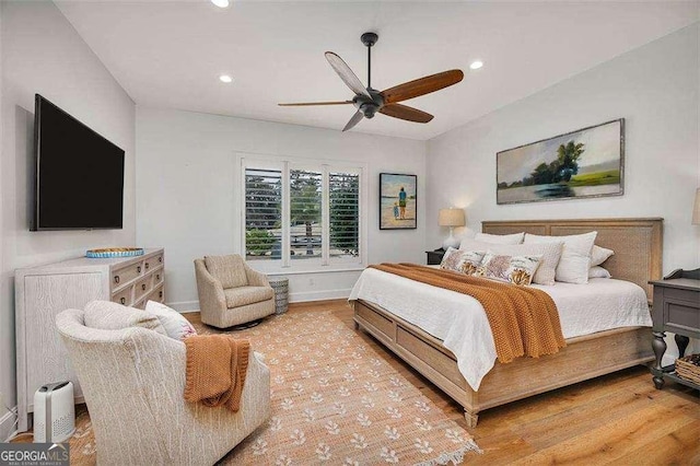 bedroom featuring ceiling fan and light hardwood / wood-style flooring