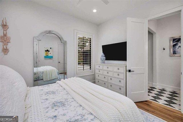 bedroom featuring ceiling fan and hardwood / wood-style floors