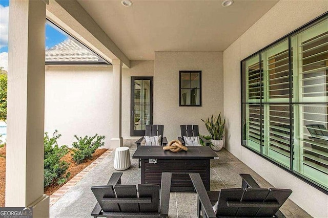 view of patio with an outdoor fire pit