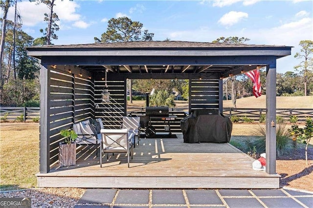 view of patio featuring a grill and a deck