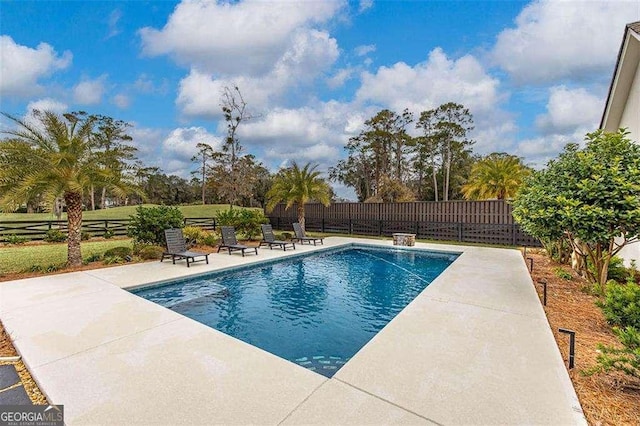 view of swimming pool with a patio area