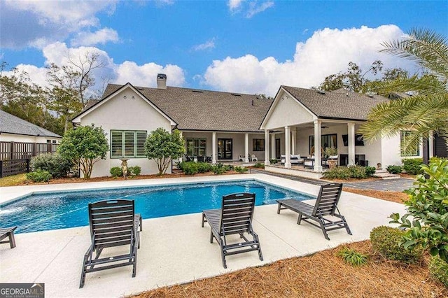 view of swimming pool with a patio and ceiling fan