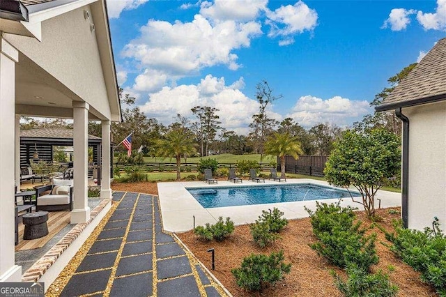 view of swimming pool featuring a patio area