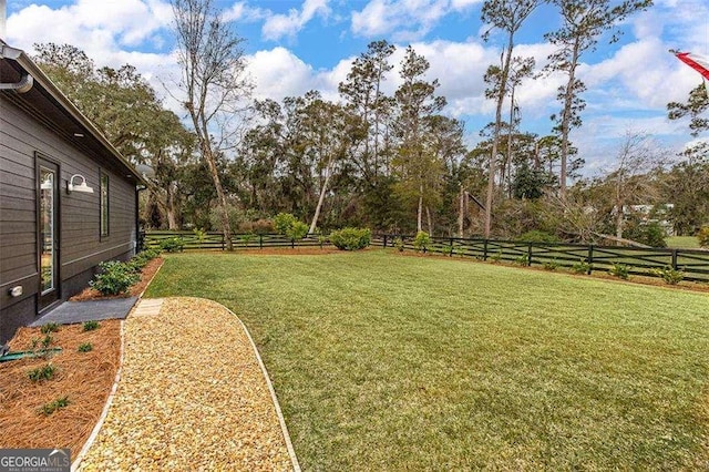 view of yard with a rural view