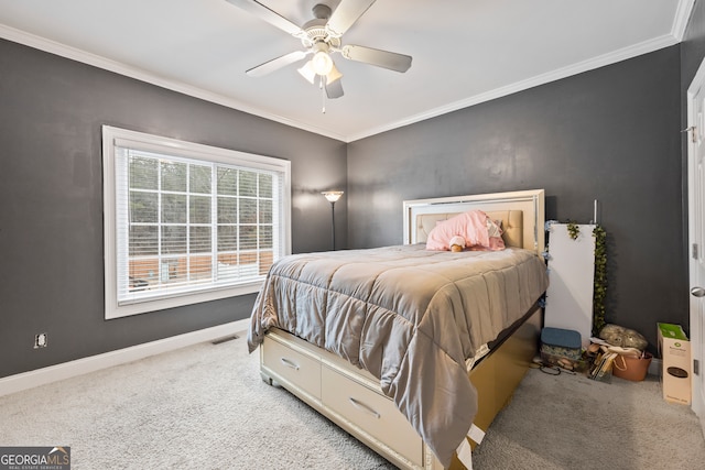 bedroom featuring crown molding, ceiling fan, and light carpet