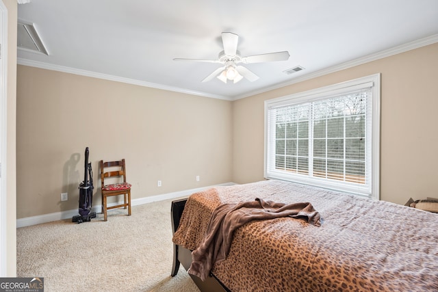 carpeted bedroom with crown molding and ceiling fan