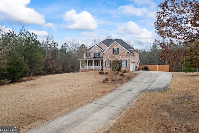 view of property with a porch and a front yard