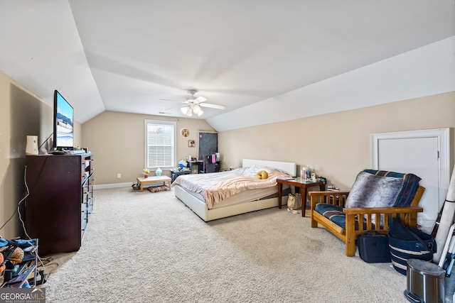 carpeted bedroom with lofted ceiling and ceiling fan