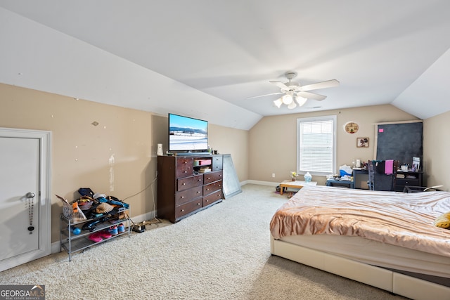 bedroom featuring ceiling fan, carpet floors, and vaulted ceiling