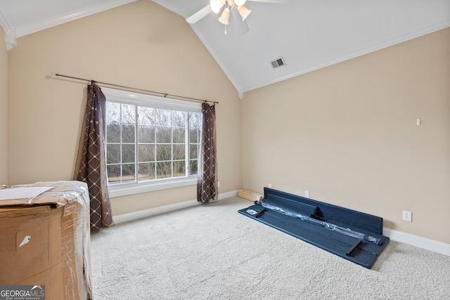 interior space with ceiling fan, ornamental molding, carpet flooring, and high vaulted ceiling