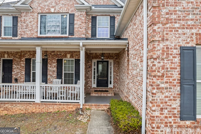 doorway to property featuring a porch