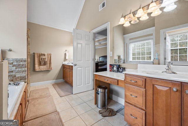 bathroom featuring tile patterned floors, ornamental molding, vaulted ceiling, and vanity