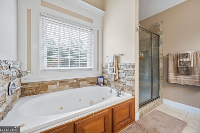 bathroom with shower with separate bathtub and tile patterned floors