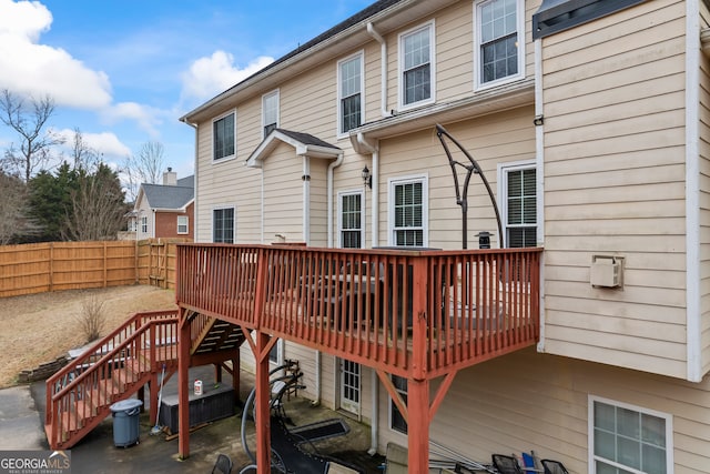 rear view of house with a wooden deck