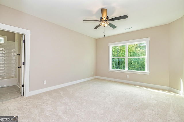 carpeted empty room with ceiling fan