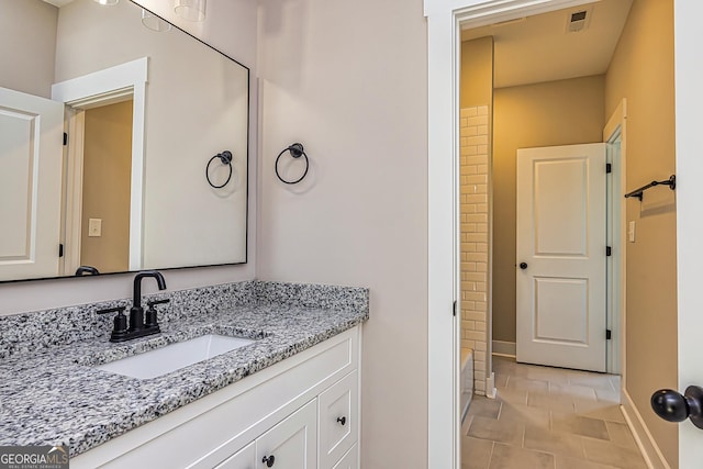 bathroom featuring vanity and tile patterned flooring