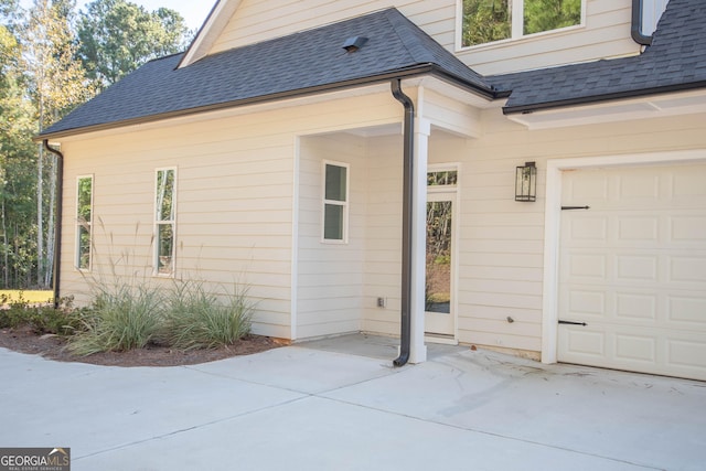 view of side of home featuring a garage