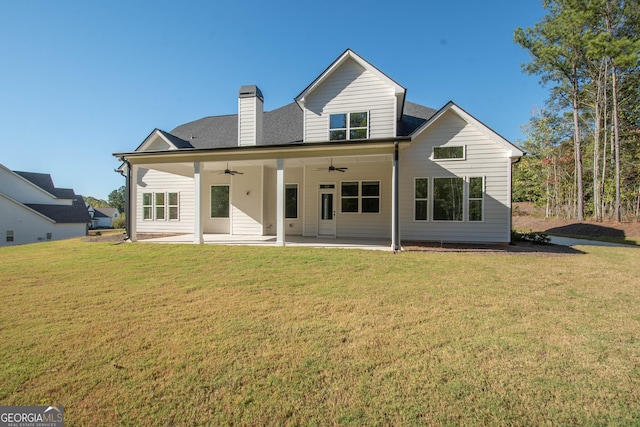 back of house with a yard, a patio, and ceiling fan