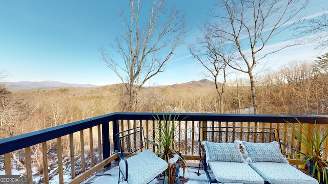 wooden deck with a mountain view