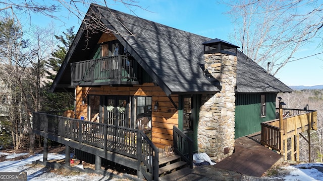 view of front facade featuring a deck and french doors