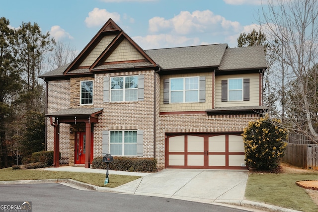 view of front facade with a garage and a front lawn