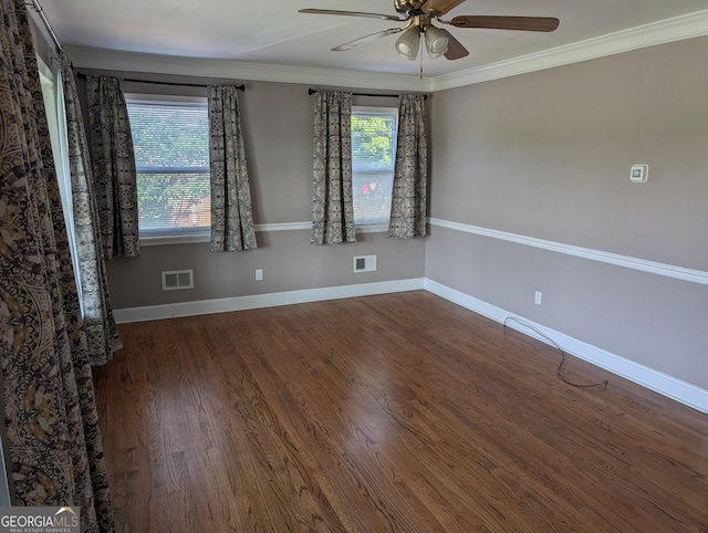 unfurnished room with ceiling fan, ornamental molding, wood finished floors, and baseboards