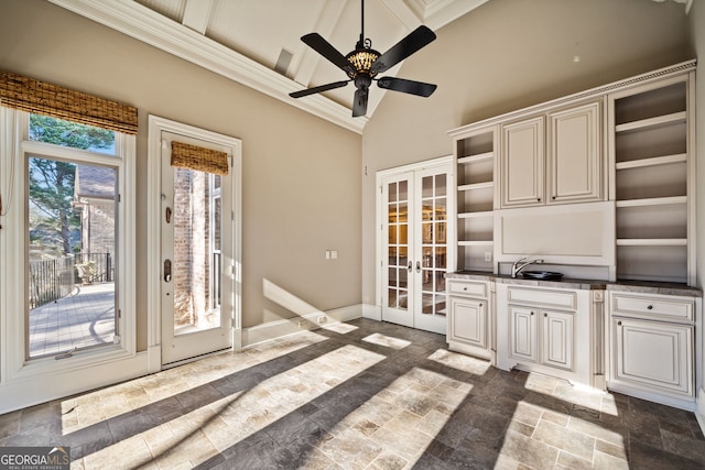 interior space featuring lofted ceiling, ceiling fan, and french doors