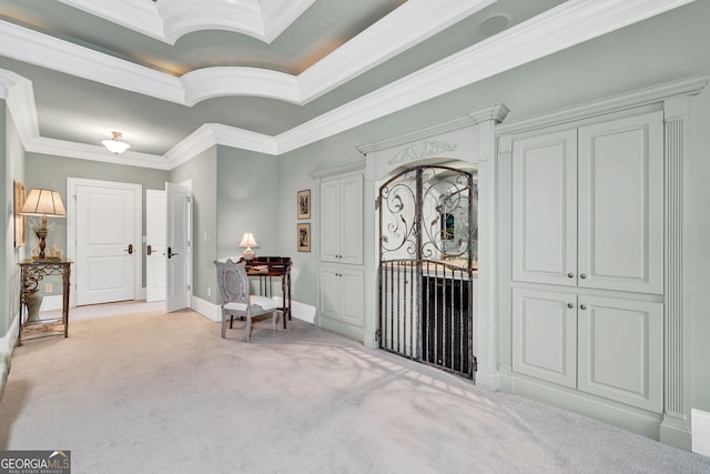 entrance foyer featuring crown molding and light colored carpet