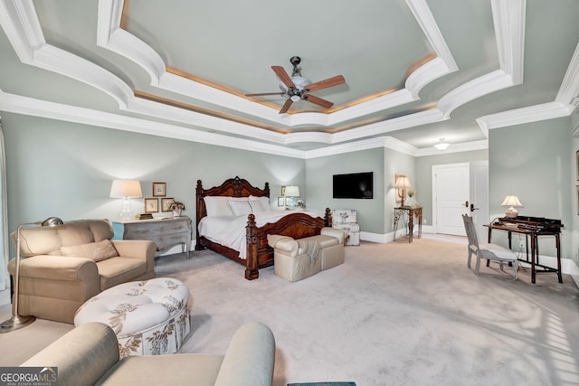 bedroom featuring crown molding, ceiling fan, a raised ceiling, and light carpet