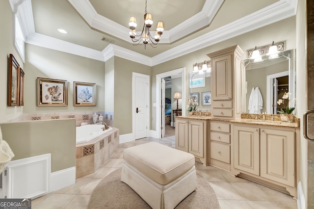 bathroom with tile patterned floors, crown molding, vanity, a tray ceiling, and tiled bath