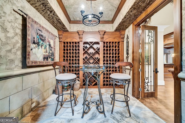 wine cellar featuring crown molding