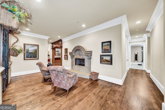 living room with crown molding and light wood-type flooring