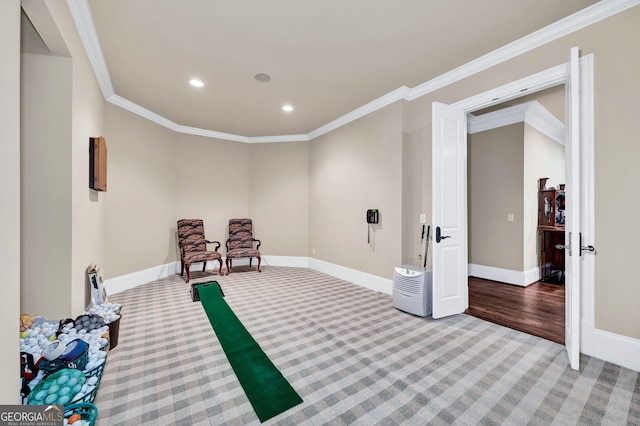 living area with ornamental molding and carpet flooring