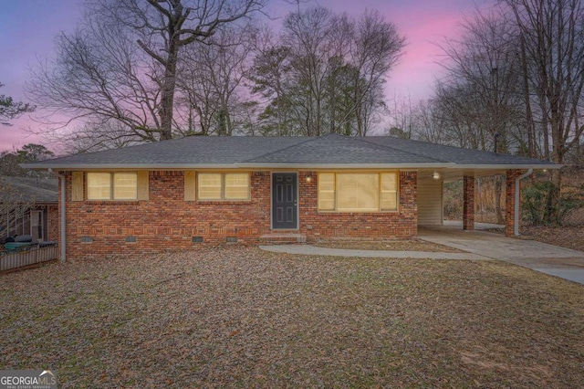 ranch-style house with a carport