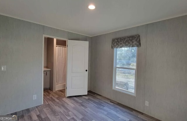 unfurnished bedroom with light wood-type flooring